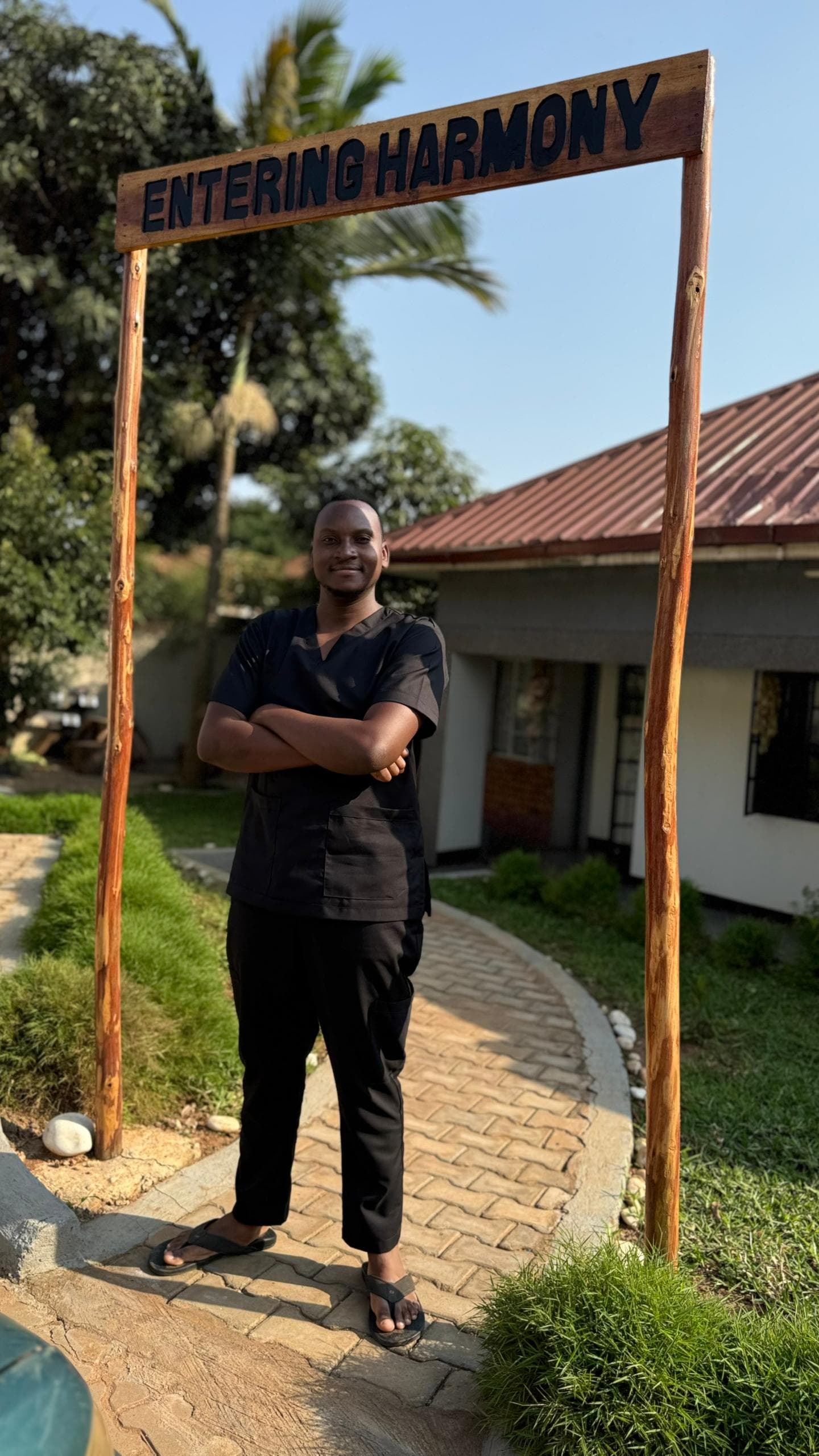 Ivan Baguma under the Entering Harmony arch