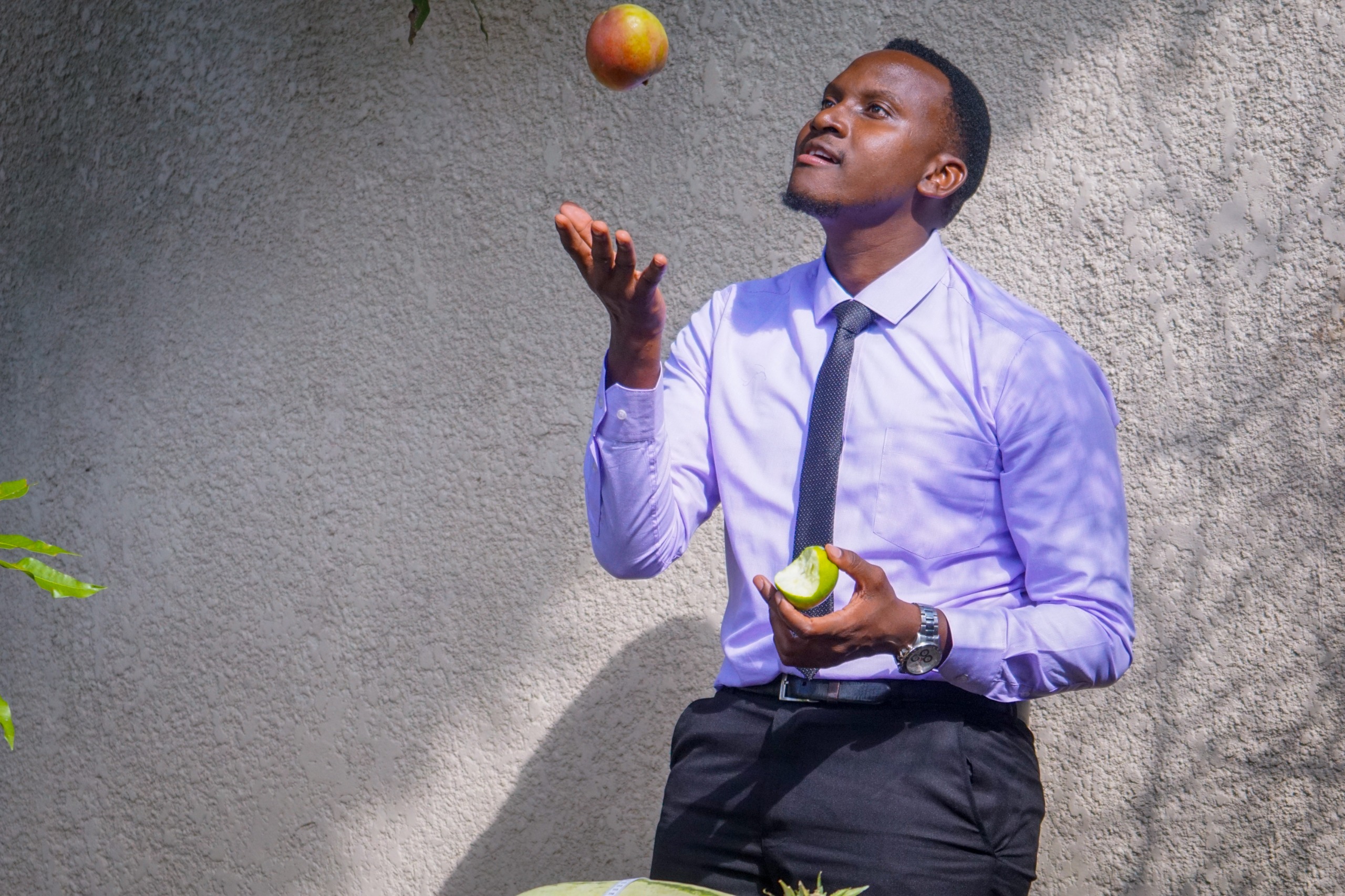Ivan tossing an apple in the air